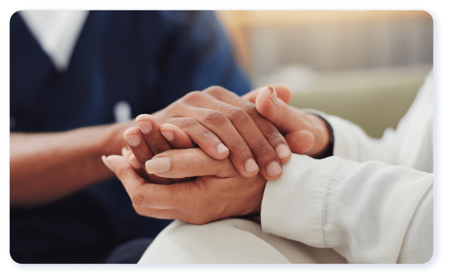 Patient and clinician holding hands